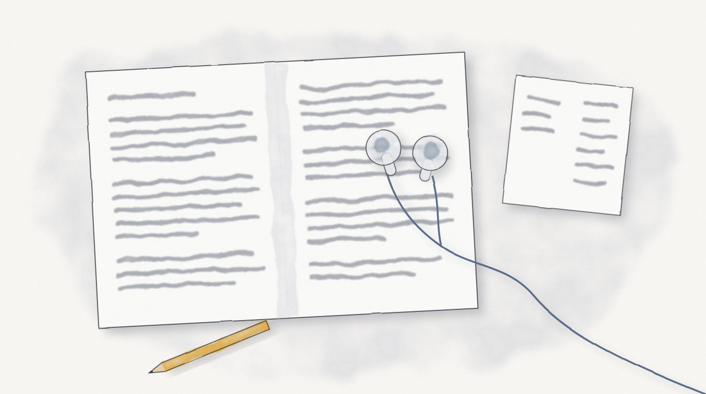 A pair of wired earbuds lying on an open textbook, the cord trailing off the desk, beside a scrap of paper with two short lists, the second one longer.