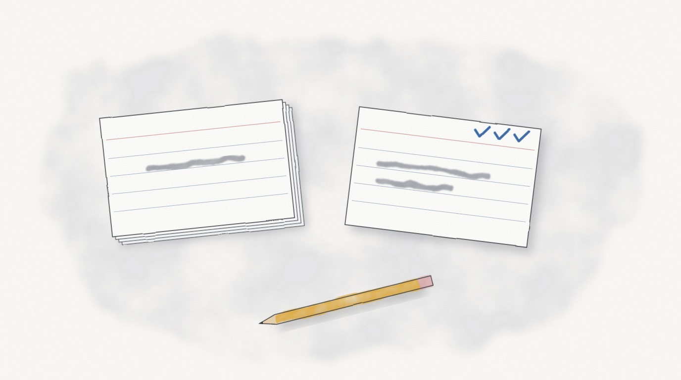 A stack of index cards beside one card pulled out with three small pencil ticks in its corner, and a pencil below.